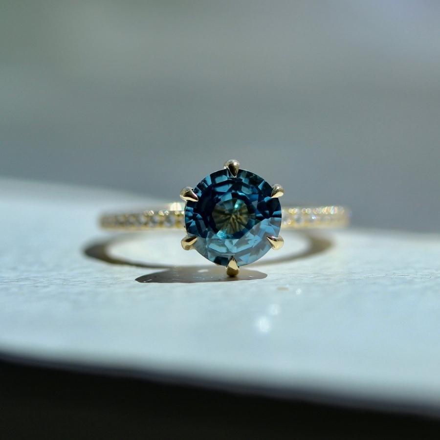 
            Iria Blue Round Brilliant Cut Sapphire Ring