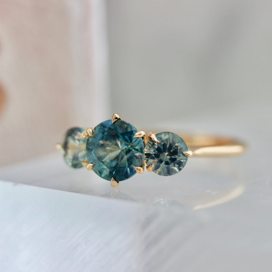 
            Sea Witch Teal Round Brilliant Cut Montana Sapphire Ring
