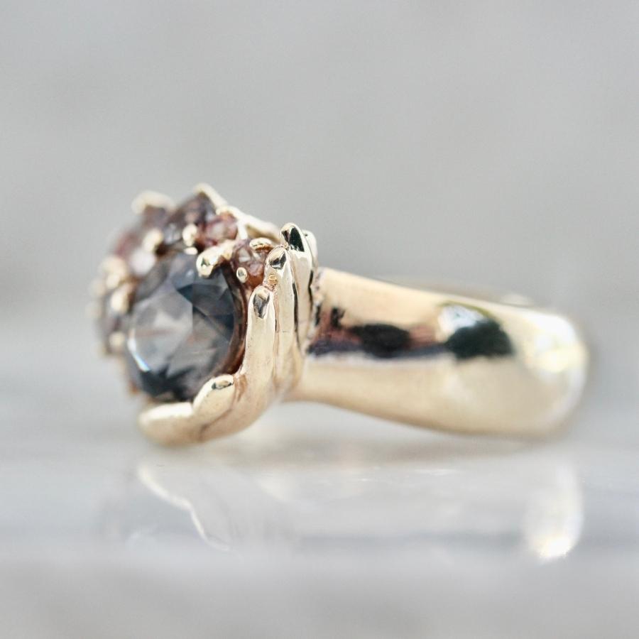 Heart in Hand Purple-Peach Oval Cut Sapphire Ring