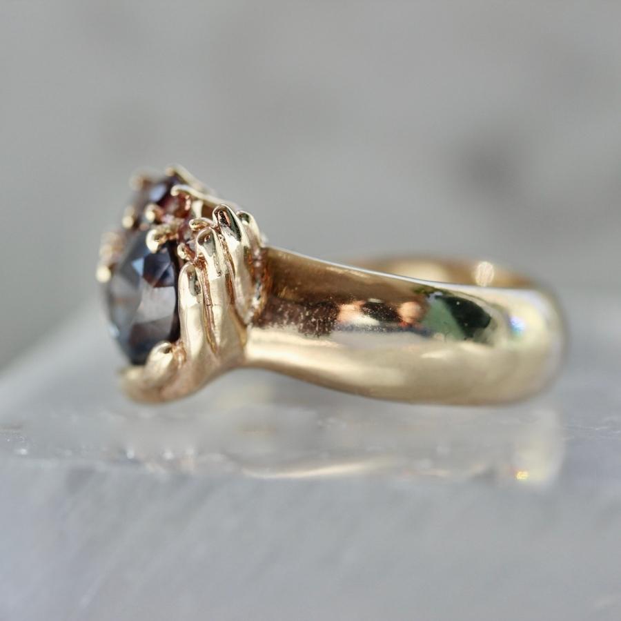 Heart in Hand Purple-Peach Oval Cut Sapphire Ring