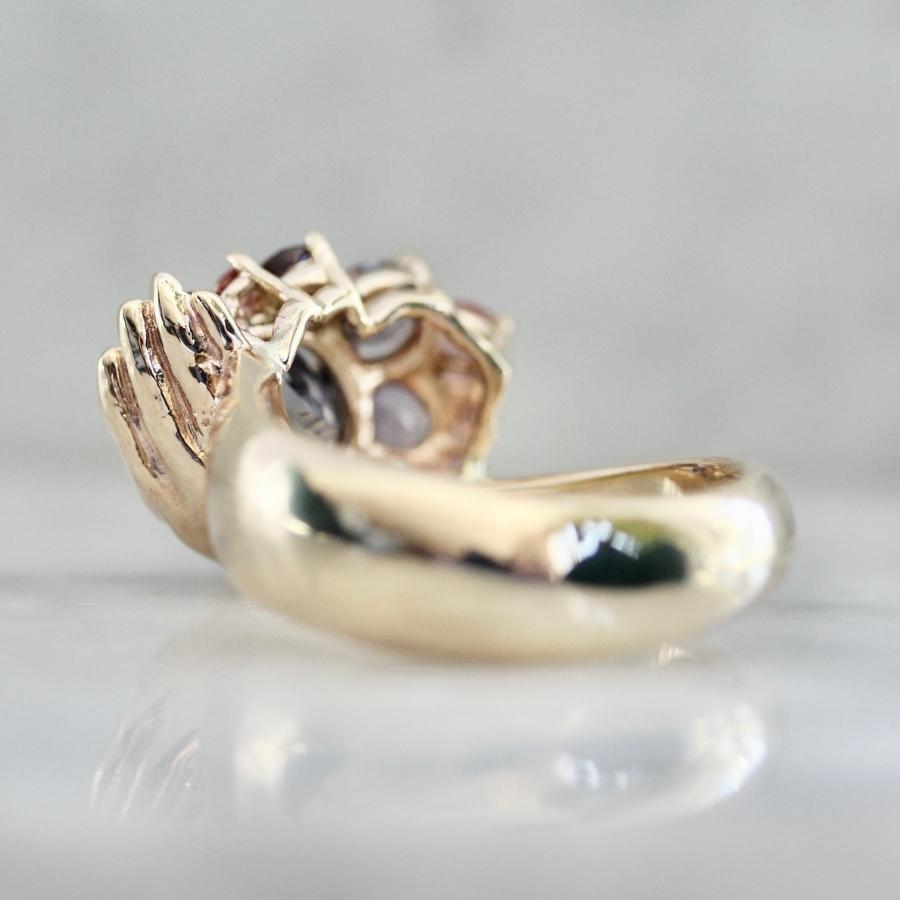 Heart in Hand Purple-Peach Oval Cut Sapphire Ring