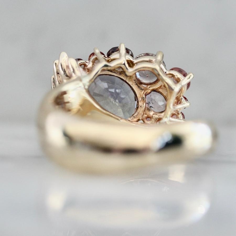 Heart in Hand Purple-Peach Oval Cut Sapphire Ring