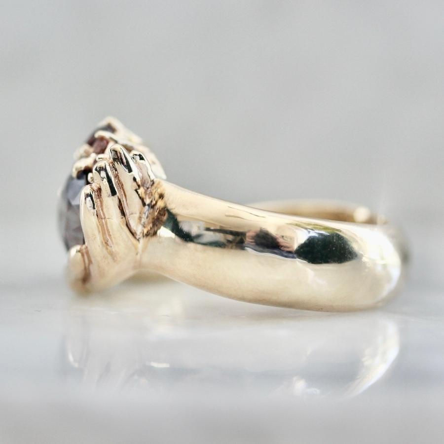 Heart in Hand Purple-Peach Oval Cut Sapphire Ring