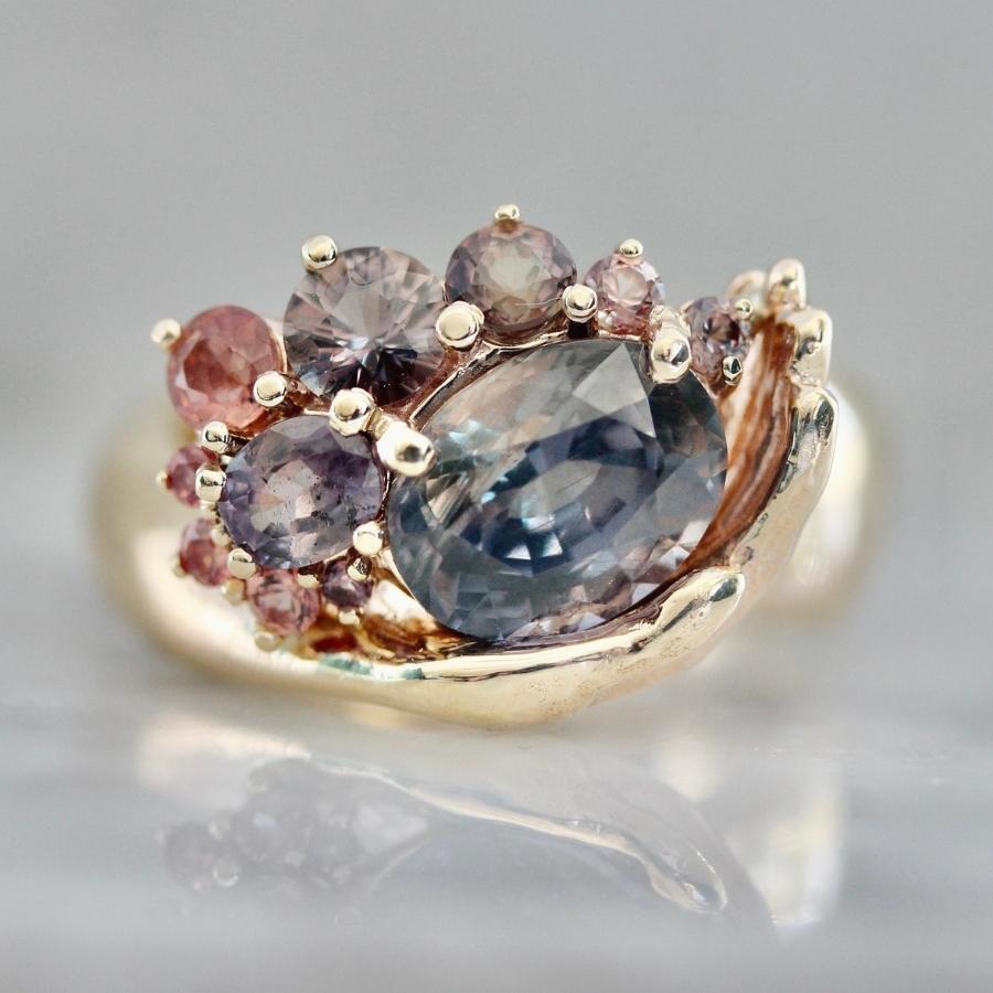 
            Heart in Hand Purple-Peach Oval Cut Sapphire Ring
