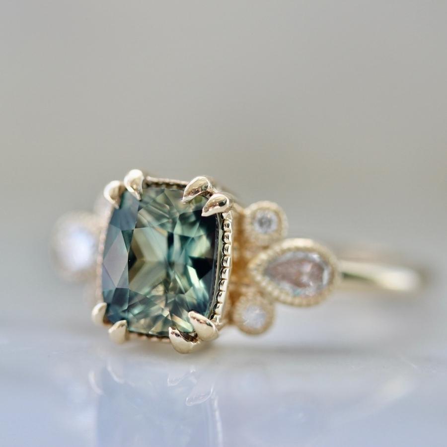 
            Parlor Trick Blue-Green Cushion Cut Sapphire Ring