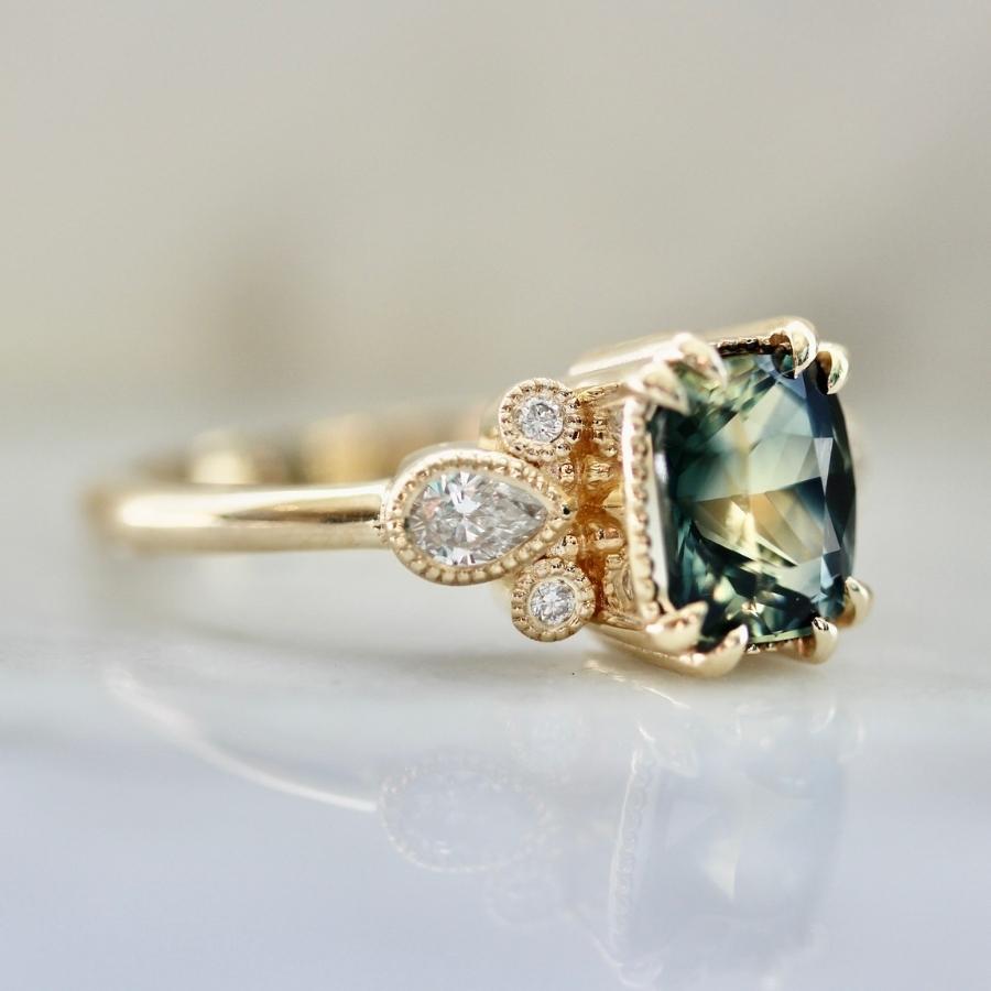 
            Parlor Trick Blue-Green Cushion Cut Sapphire Ring