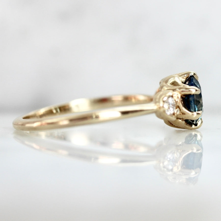 
            Shockwave Teal Round Brilliant Cut Sapphire Ring