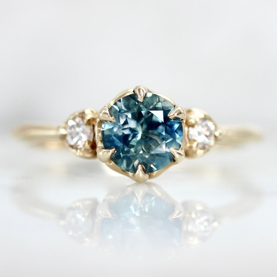 Shockwave Teal Round Brilliant Cut Sapphire Ring