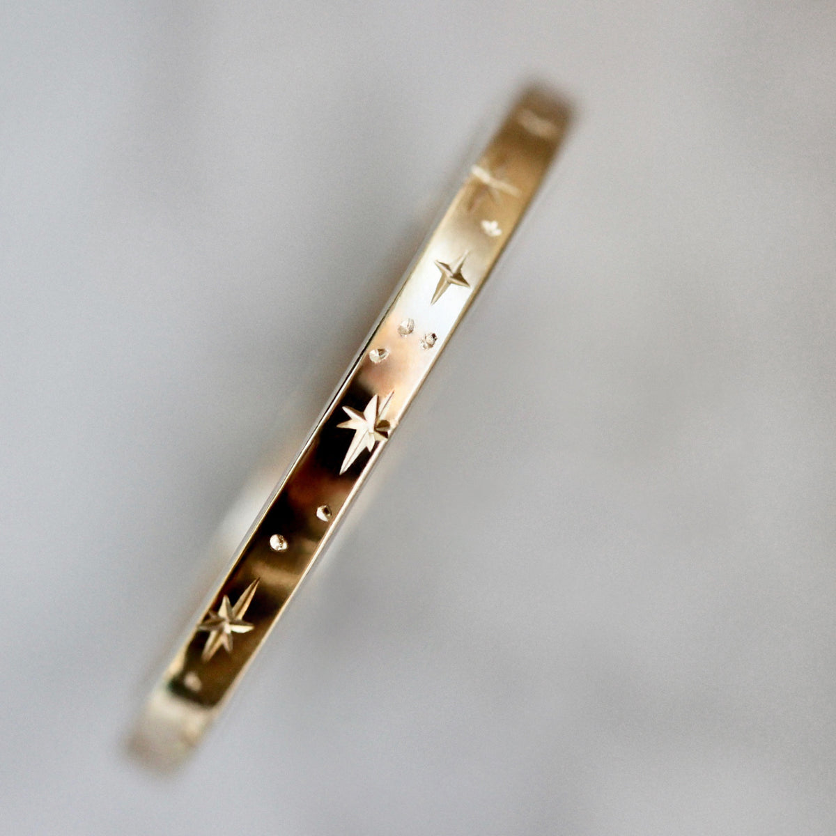 
            Orion Star Engraved Gold Band