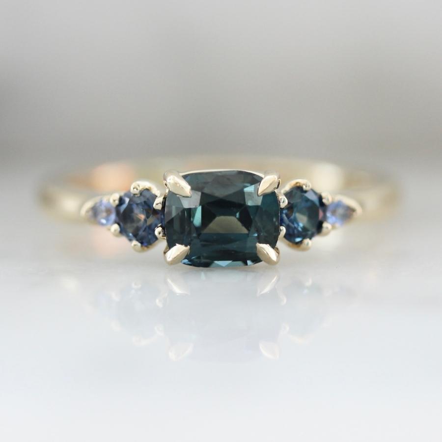 Victory Lap Teal Cushion Cut Sapphire Ring