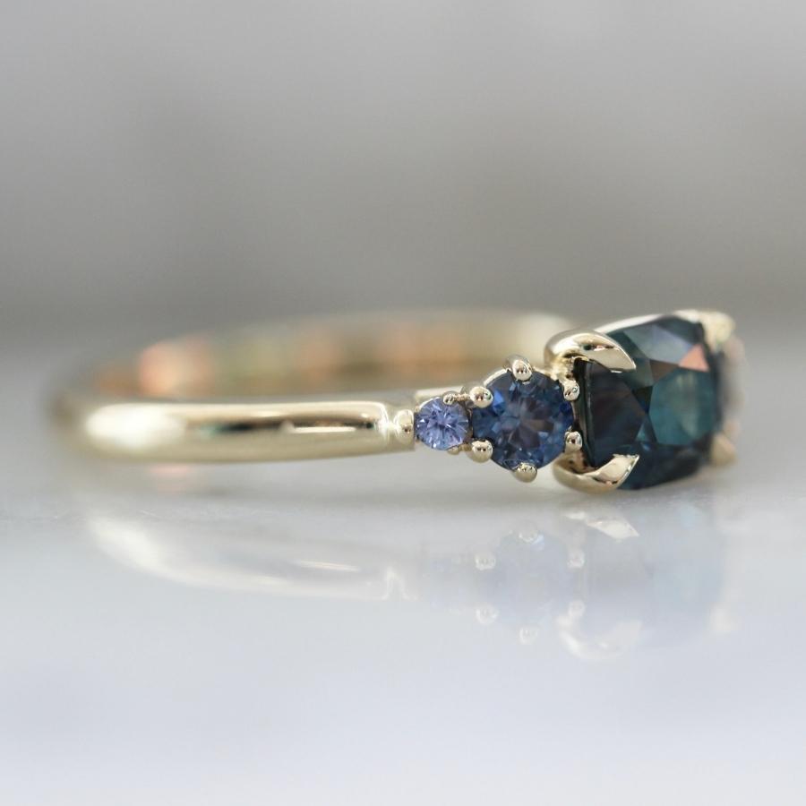 Victory Lap Teal Cushion Cut Sapphire Ring
