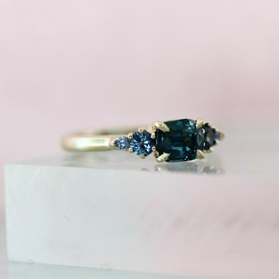 Victory Lap Teal Cushion Cut Sapphire Ring
