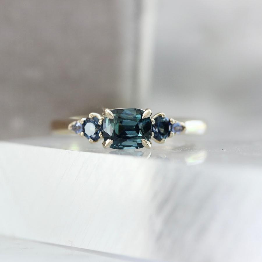 Victory Lap Teal Cushion Cut Sapphire Ring