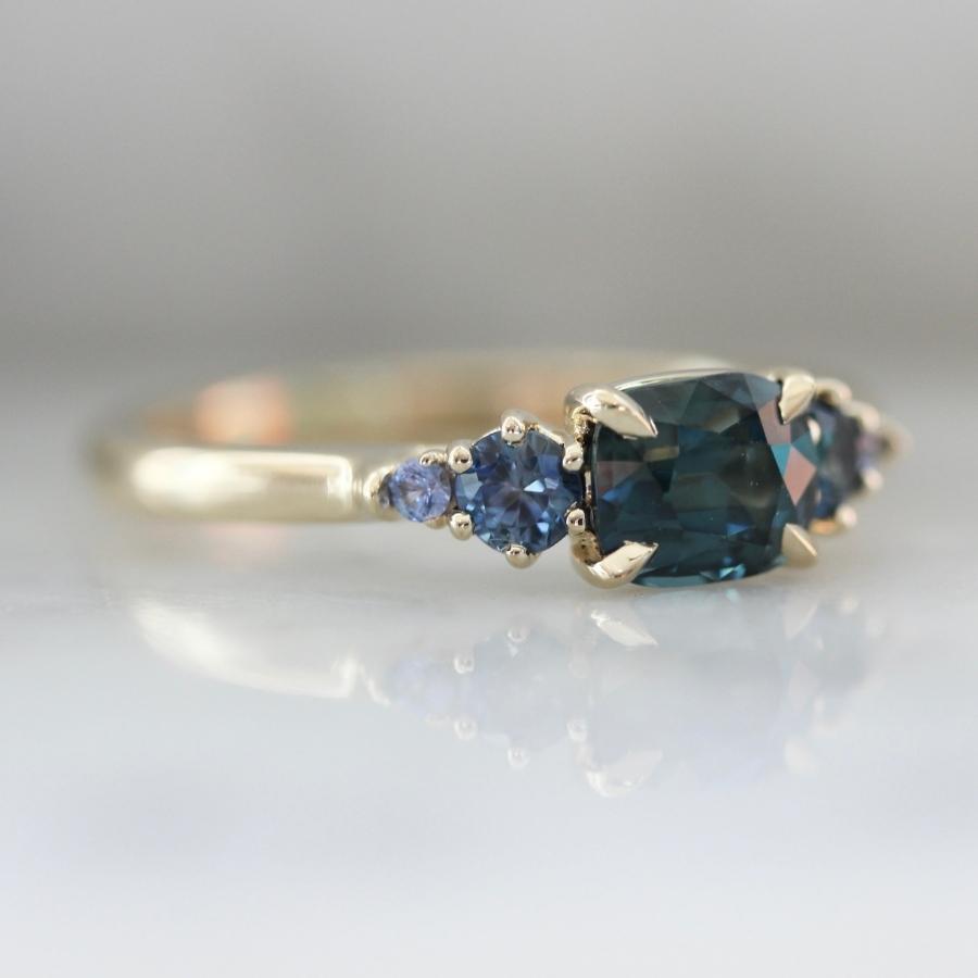 Victory Lap Teal Cushion Cut Sapphire Ring