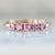 Swan Song Pink Round Brilliant Cut Sapphire Band