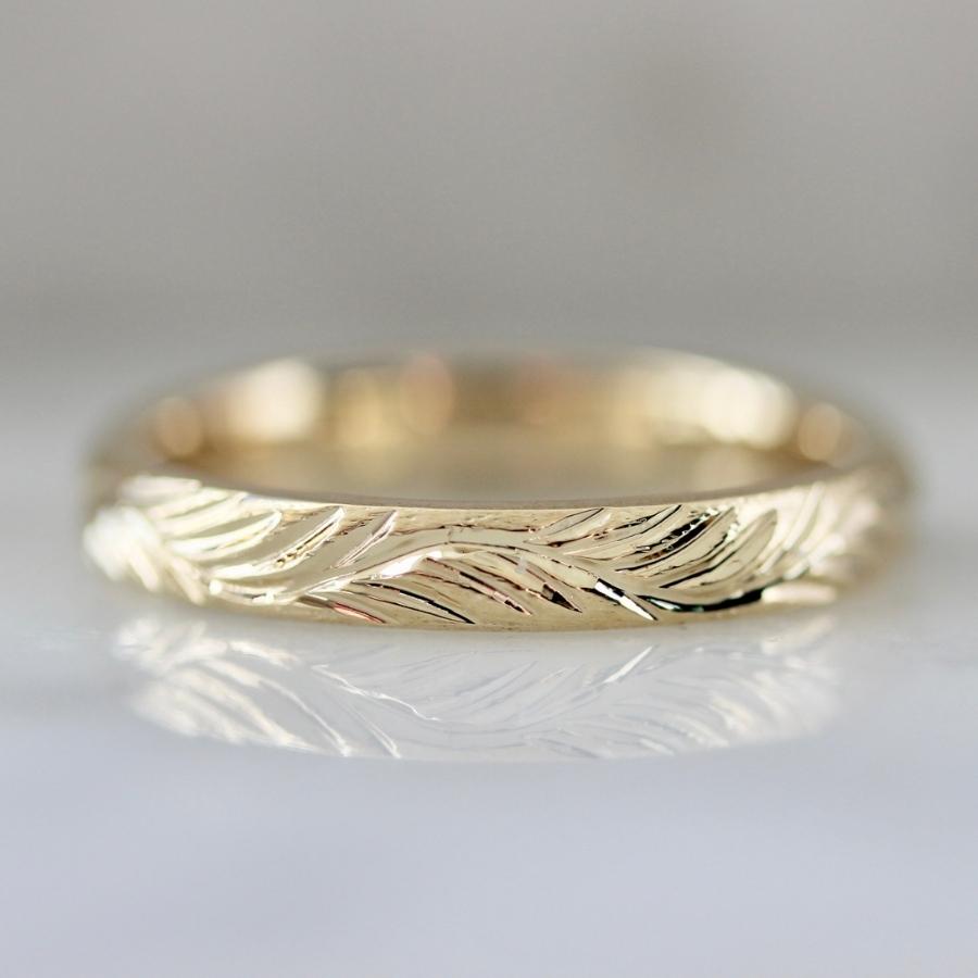 
            wavy engraved gold band